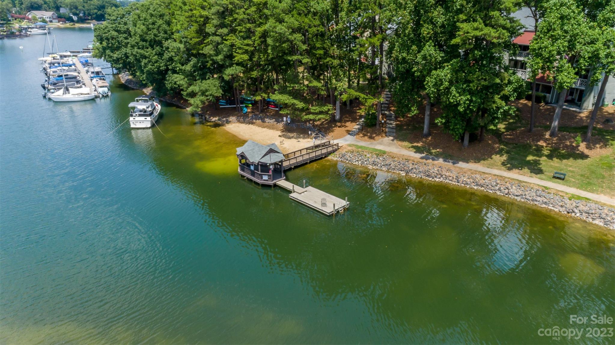 20101 Henderson Road, Unit H Cornelius, NC 28031 - Photo 43 of 48 an aerial view of a house with swimming pool a yard and a patio
