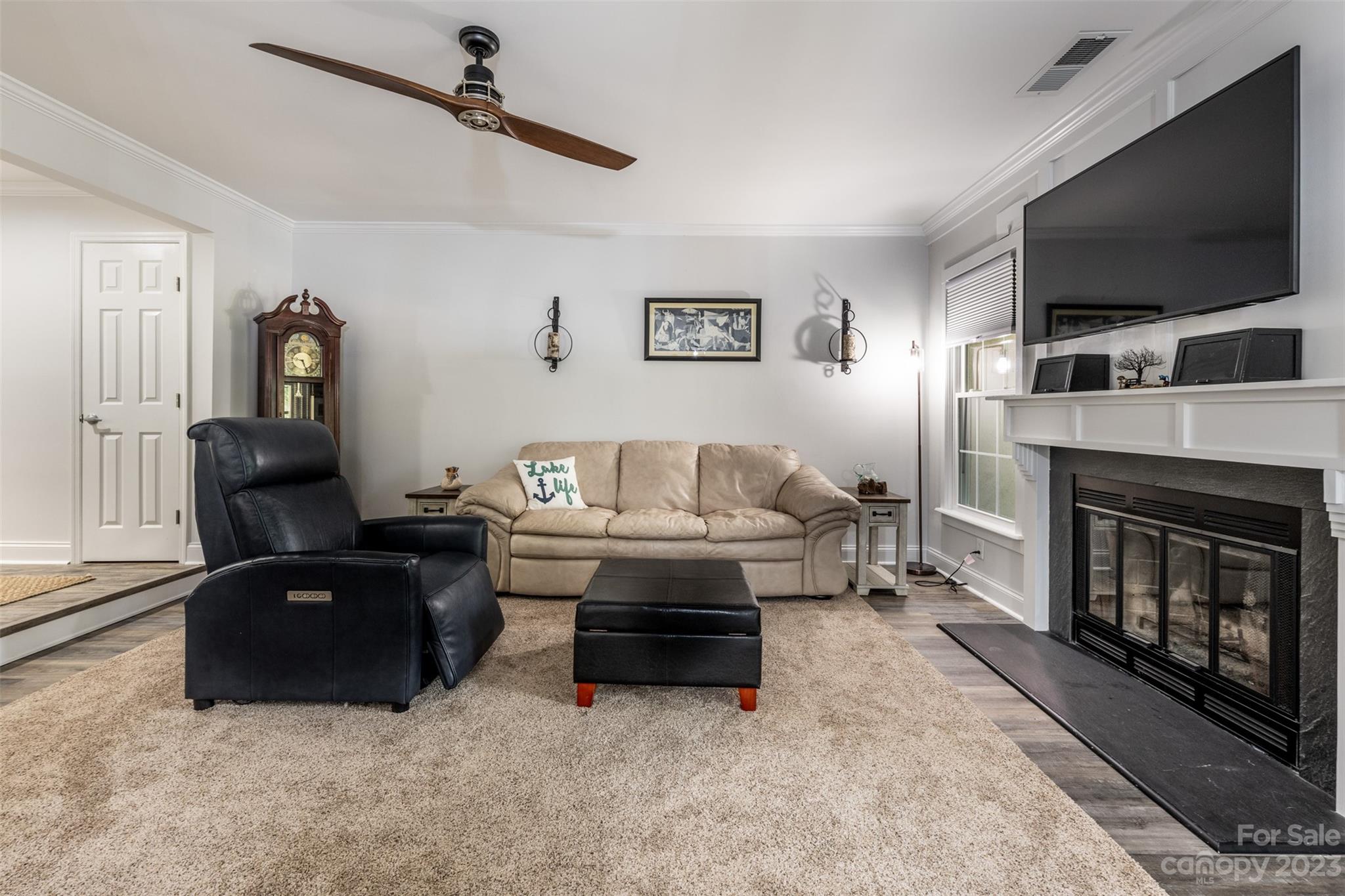20101 Henderson Road, Unit H Cornelius, NC 28031 - Photo 5 of 48 a living room with furniture and a flat screen tv
