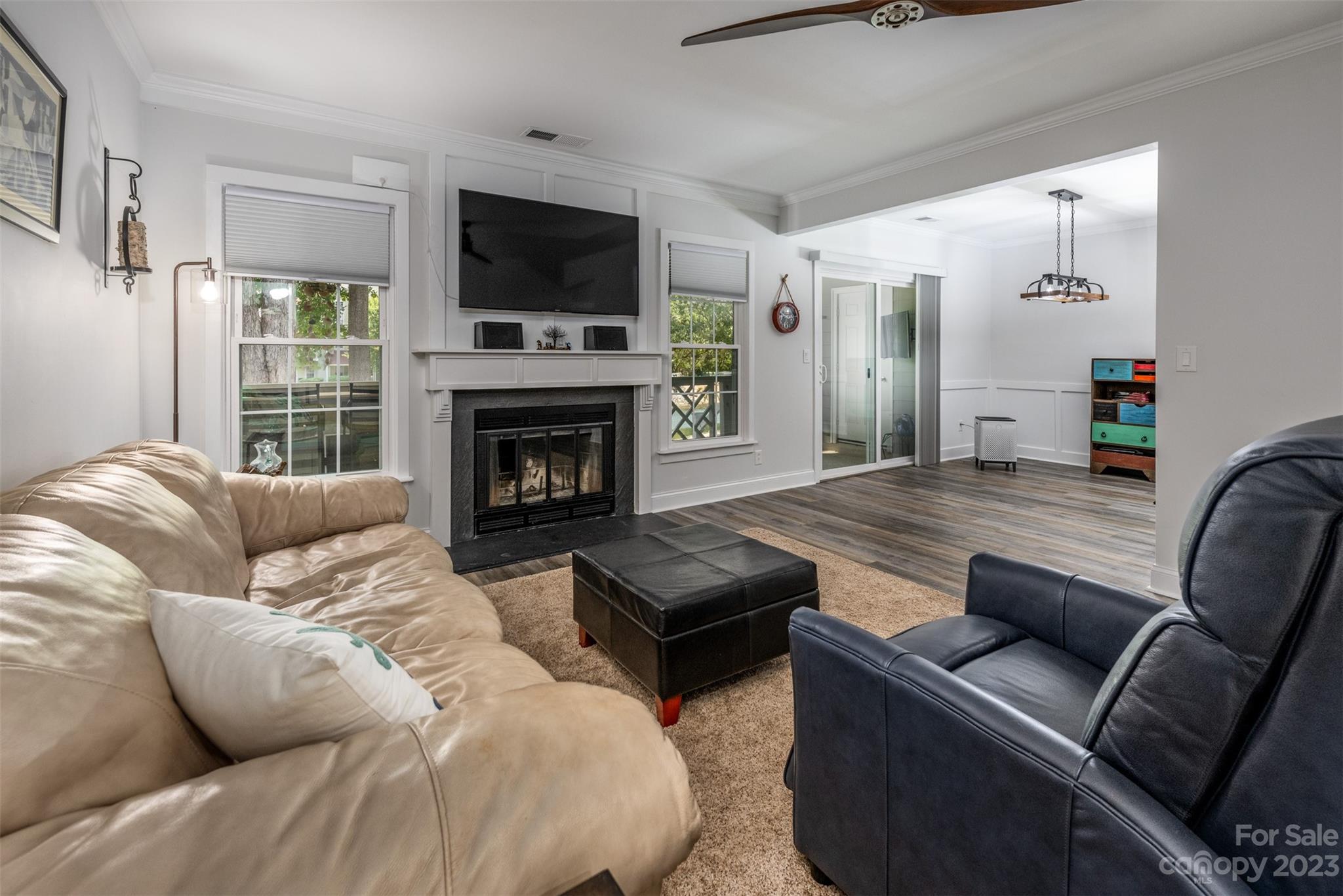 20101 Henderson Road, Unit H Cornelius, NC 28031 - Photo 6 of 48 a living room with furniture fireplace and flat screen tv