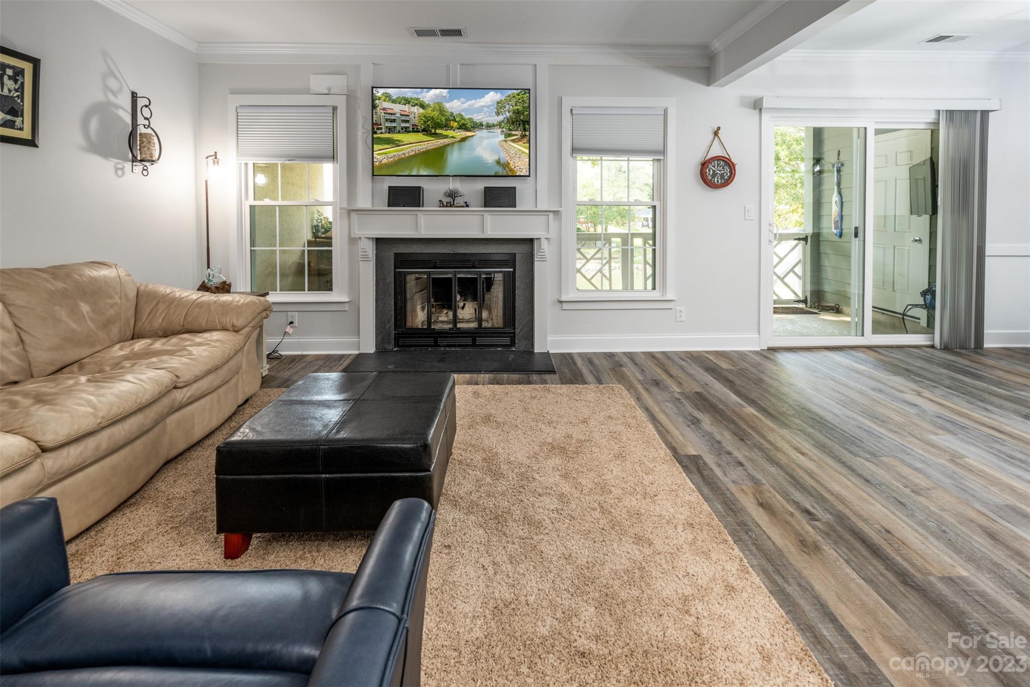 20101 Henderson Road, Unit H Cornelius, NC 28031 - Photo 7 of 48 a living room with furniture and a fireplace