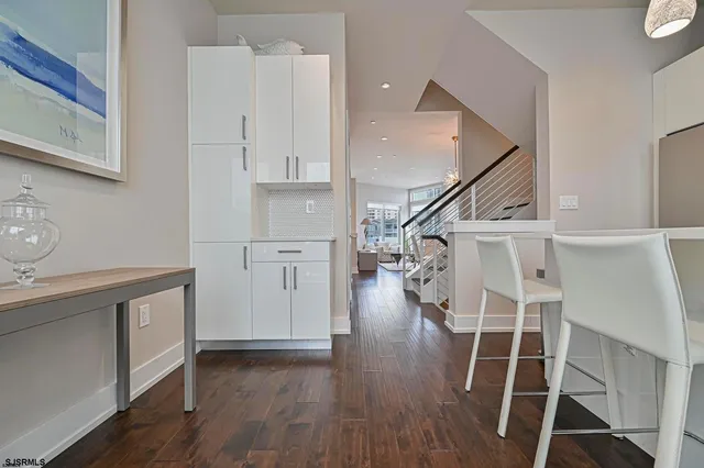 a bathroom with a toilet a sink and vanity