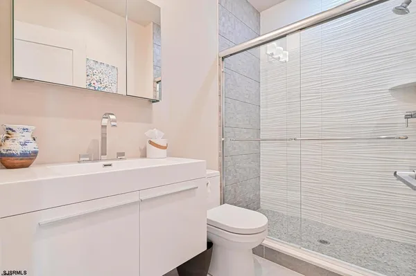 a bedroom with a bed and a table