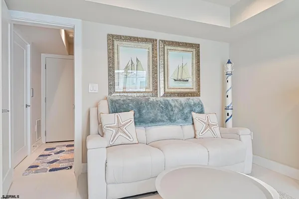 a bedroom with a bed and glass door