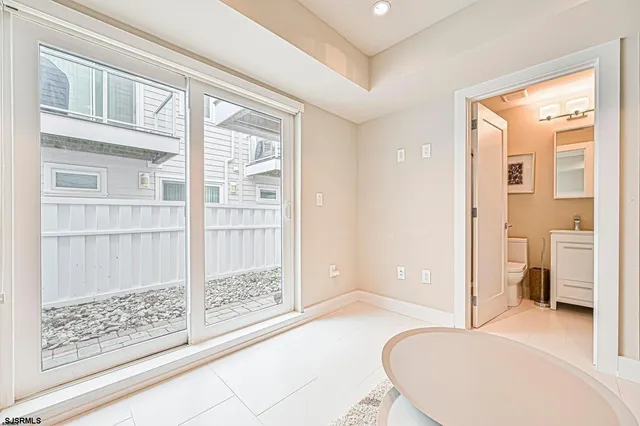 a white toilet sitting next to a bathroom sink