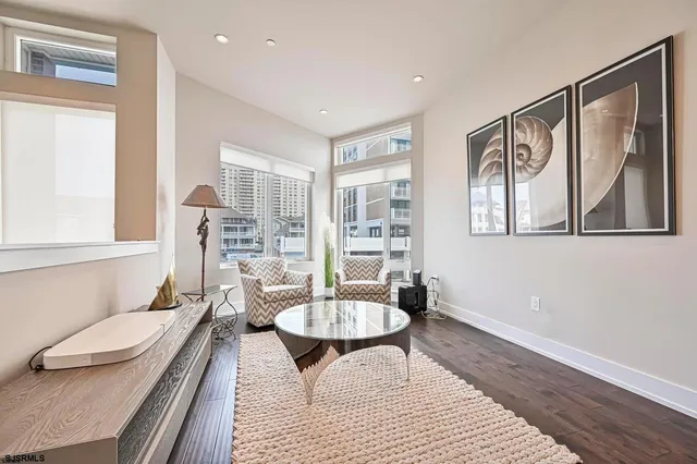a living room with furniture and a rug