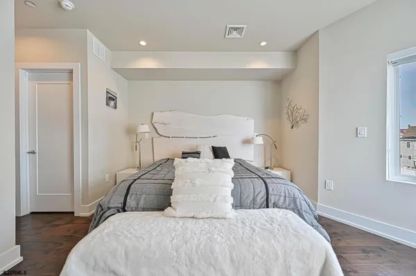 a bedroom with bed and window