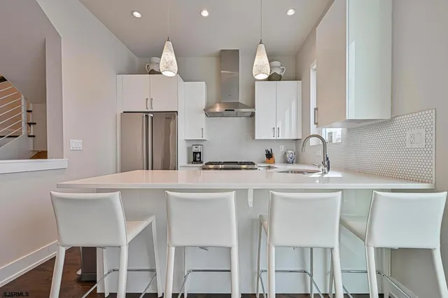 a view of dining room with wooden floor and fan