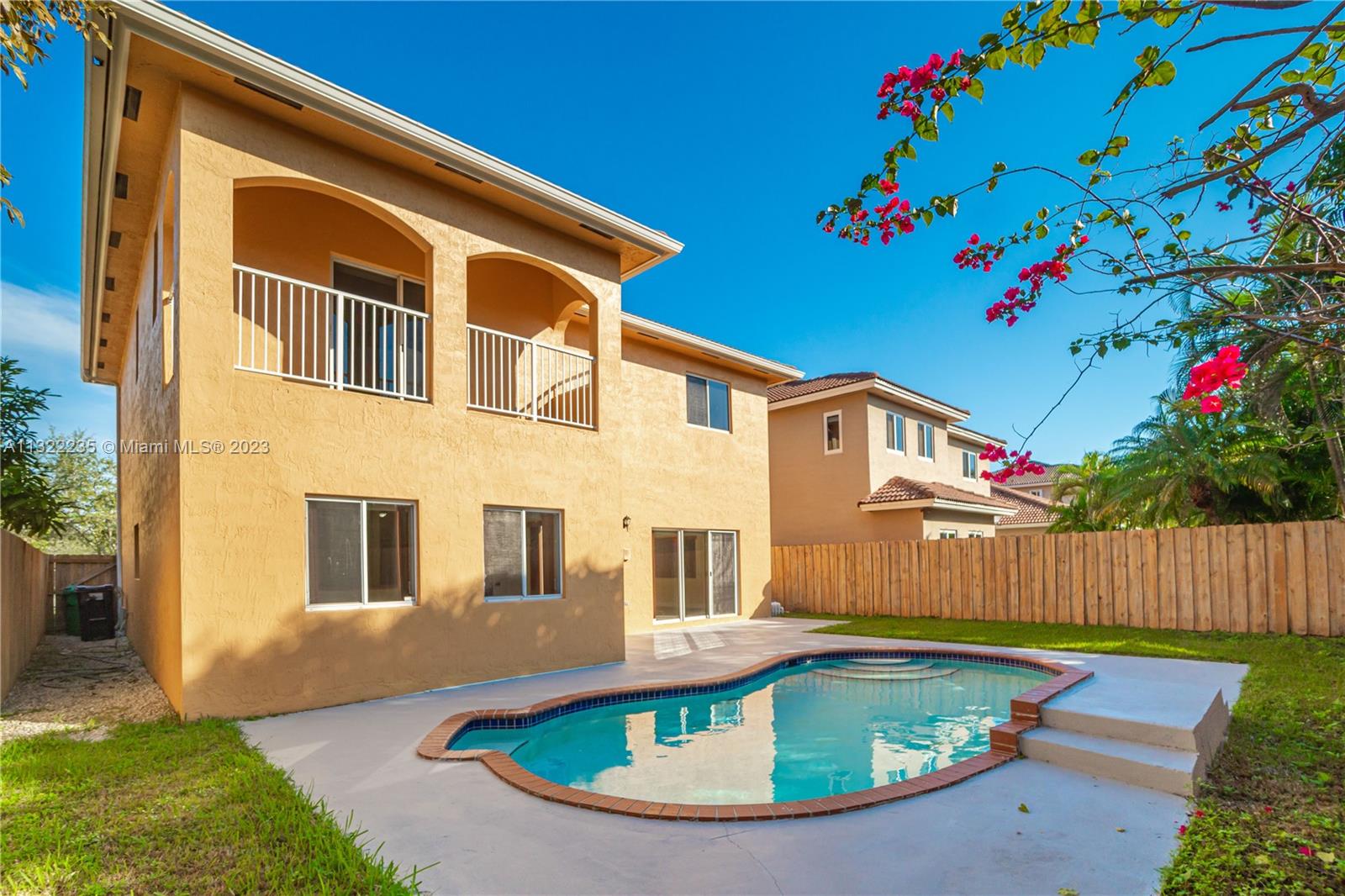 a front view of a house with swimming pool
