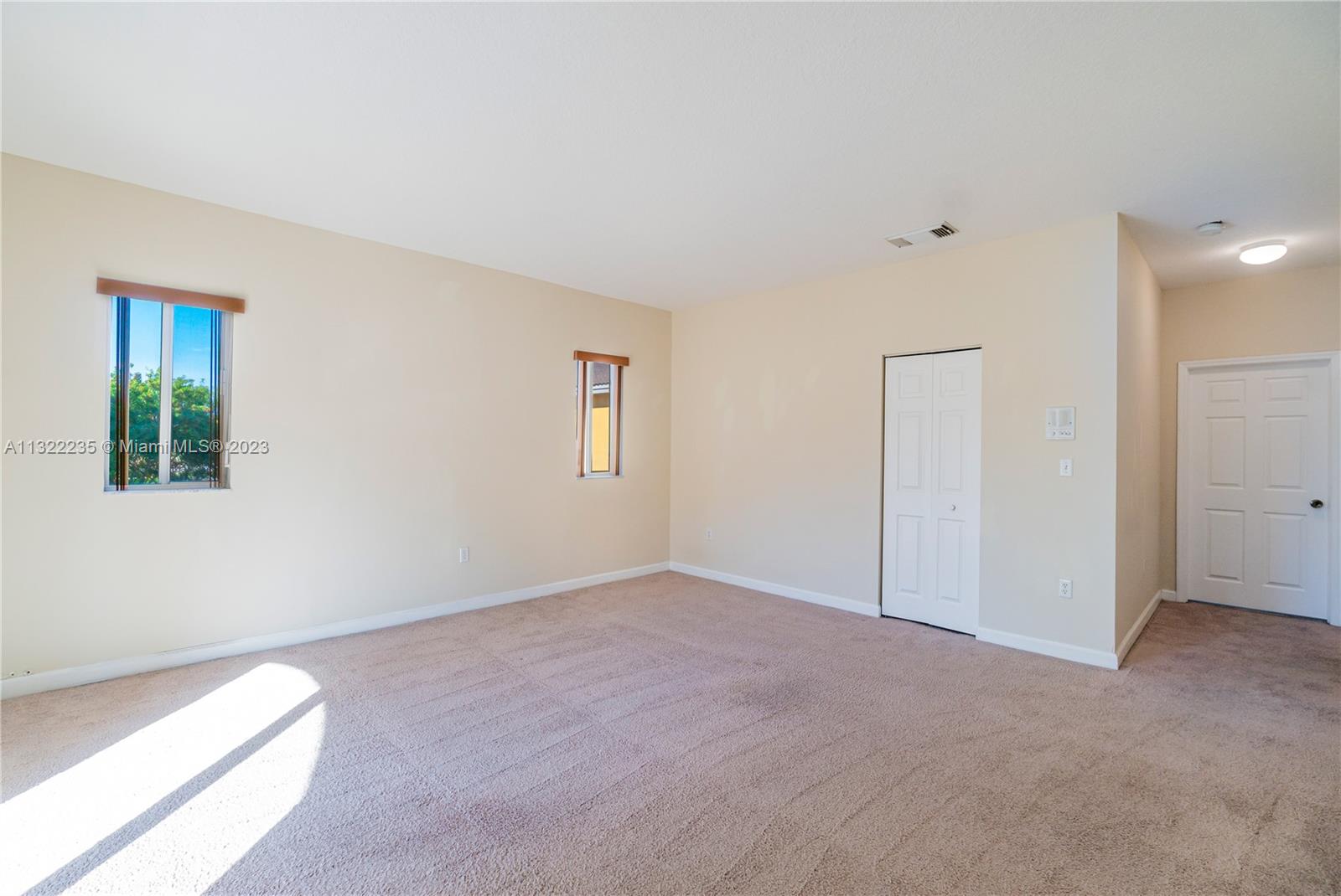 13040 Southwest 142nd Terrace Miami, FL 33186 - Photo 20 of 26 an empty room with windows