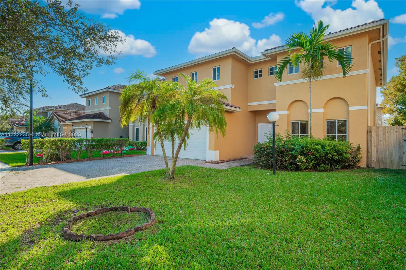 13040 Southwest 142nd Terrace Miami, FL 33186 - Photo 2 of 26 a front view of house with yard and green space