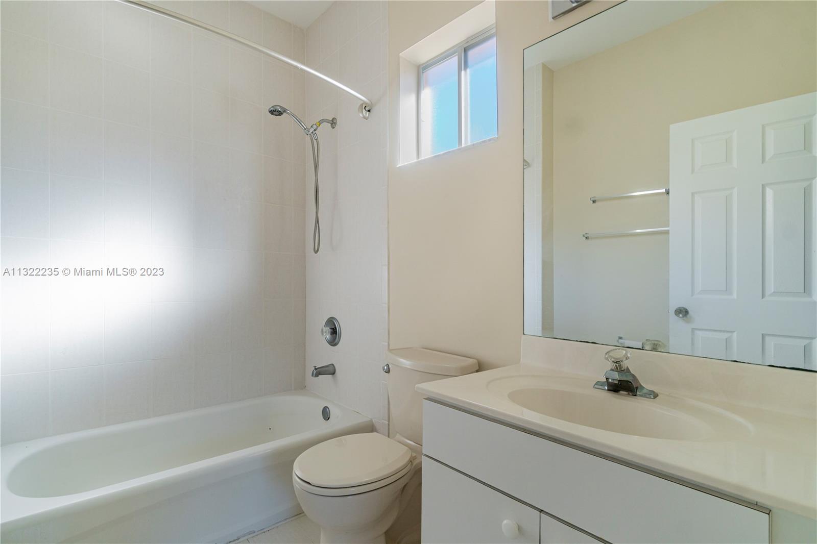 13040 Southwest 142nd Terrace Miami, FL 33186 - Photo 21 of 26 a bathroom with a sink toilet and shower