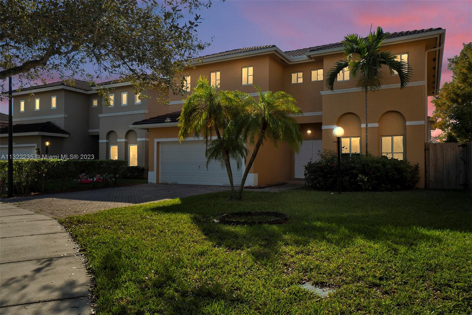 13040 Southwest 142nd Terrace Miami, FL 33186 - Photo 22 of 26 a front view of a house with garden