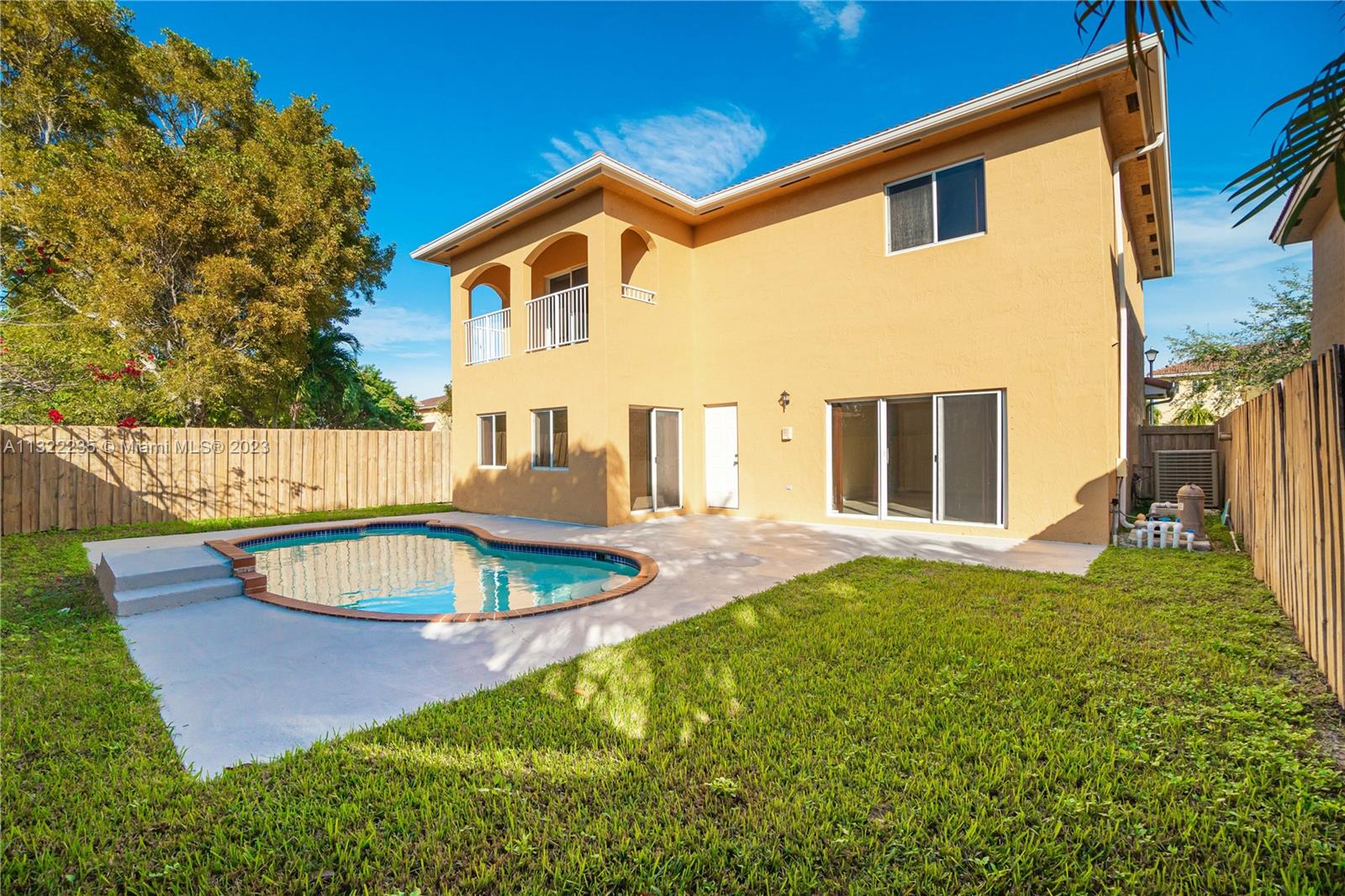13040 Southwest 142nd Terrace Miami, FL 33186 - Photo 3 of 26 a view of a backyard with swimming pool