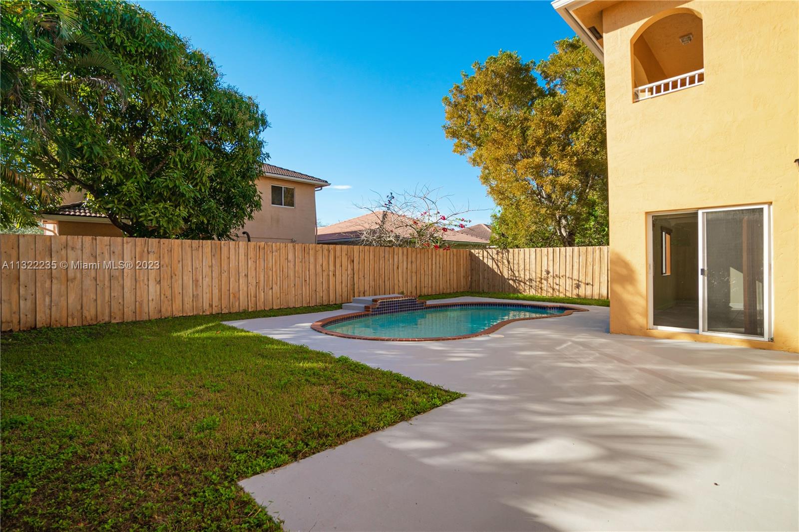 13040 Southwest 142nd Terrace Miami, FL 33186 - Photo 4 of 26 a view of a back yard of the house