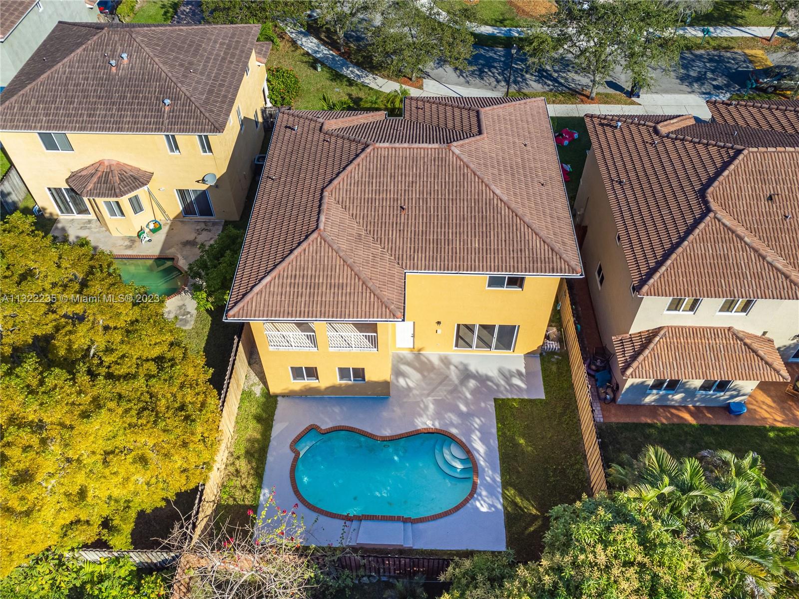 13040 Southwest 142nd Terrace Miami, FL 33186 - Photo 5 of 26 an aerial view of a house with yard swimming pool and outdoor seating