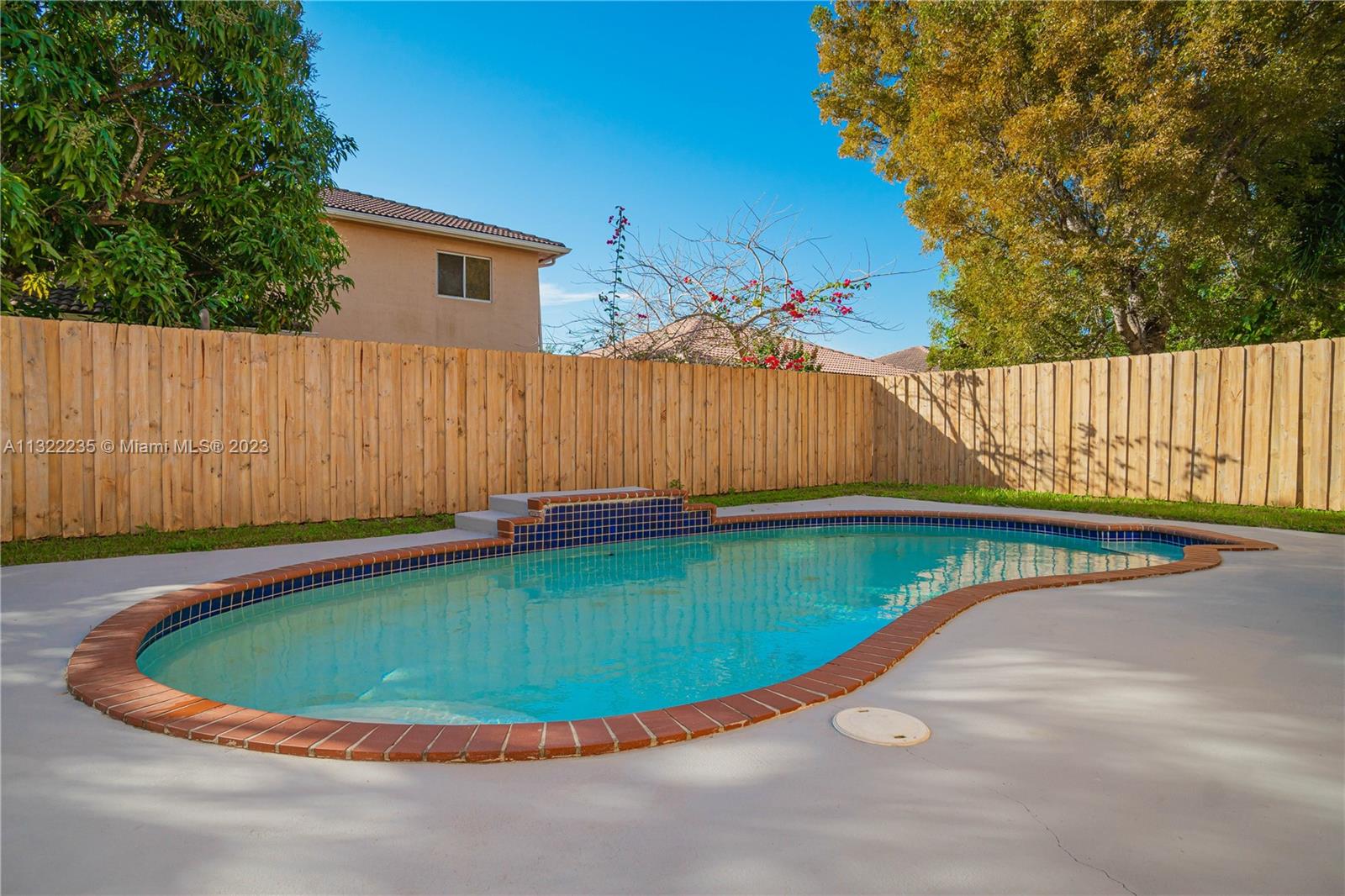 13040 Southwest 142nd Terrace Miami, FL 33186 - Photo 7 of 26 a view of swimming pool having outdoor seating
