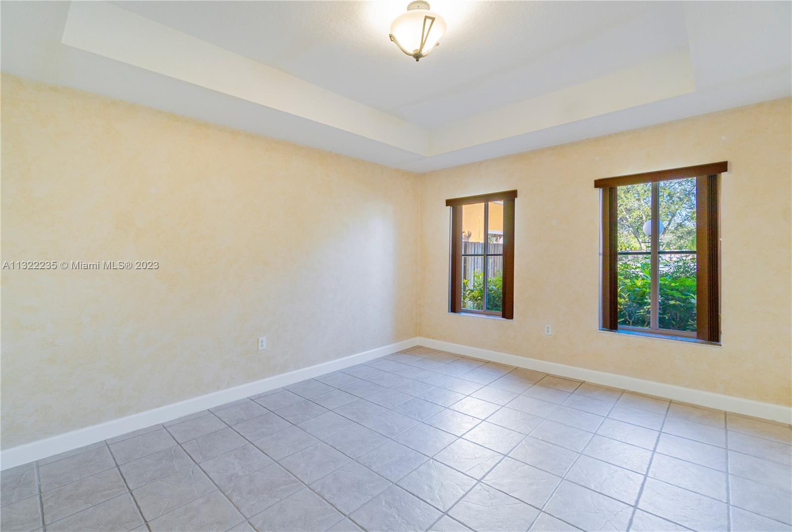 13040 Southwest 142nd Terrace Miami, FL 33186 - Photo 10 of 26 an empty room with windows