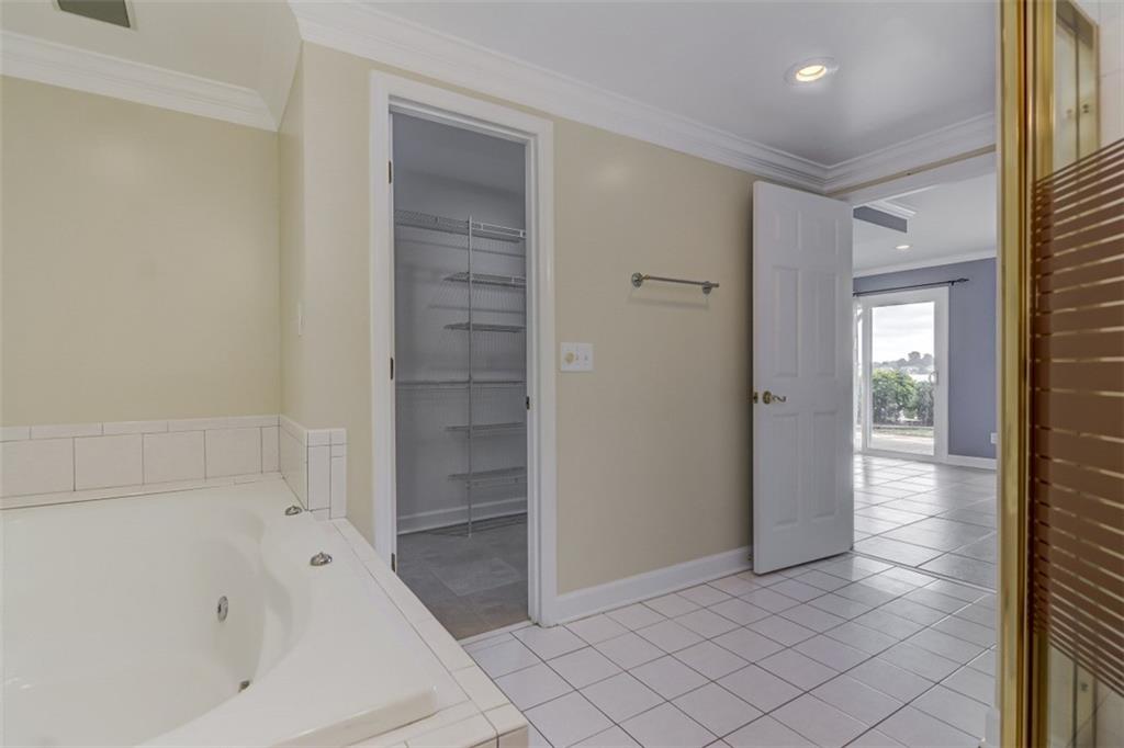 3972 Lake Shore Road South Denver, NC 28037 - Photo 25 of 48 a bathroom with a bathtub and shower