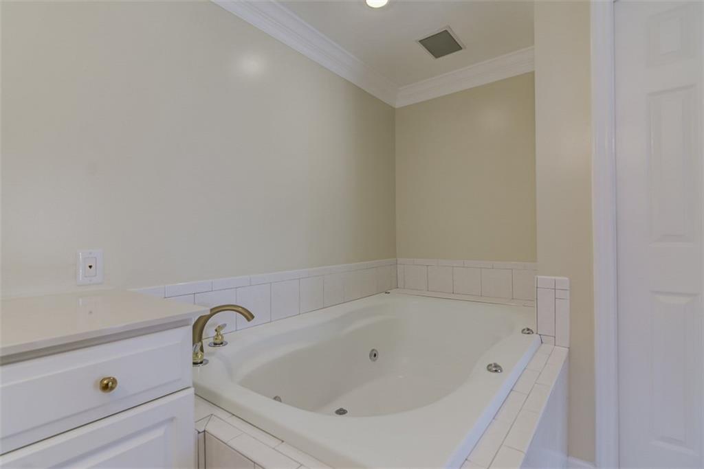 3972 Lake Shore Road South Denver, NC 28037 - Photo 26 of 48 a white bath tub sitting in a bathroom