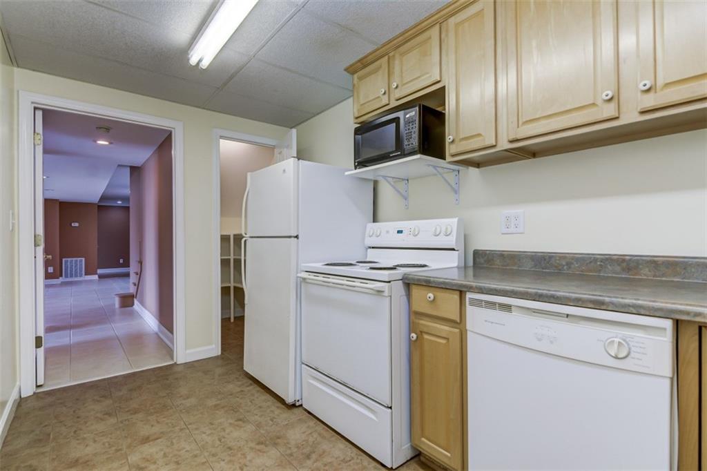 3972 Lake Shore Road South Denver, NC 28037 - Photo 28 of 48 a kitchen with stainless steel appliances granite countertop a refrigerator stove and sink
