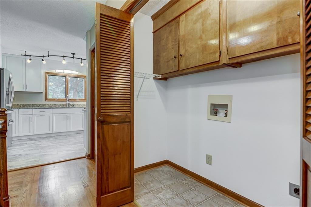 3972 Lake Shore Road South Denver, NC 28037 - Photo 32 of 48 a view of a kitchen with wooden floor and cabinets