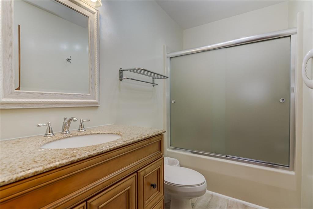 3972 Lake Shore Road South Denver, NC 28037 - Photo 35 of 48 a bathroom with a granite countertop sink toilet and shower