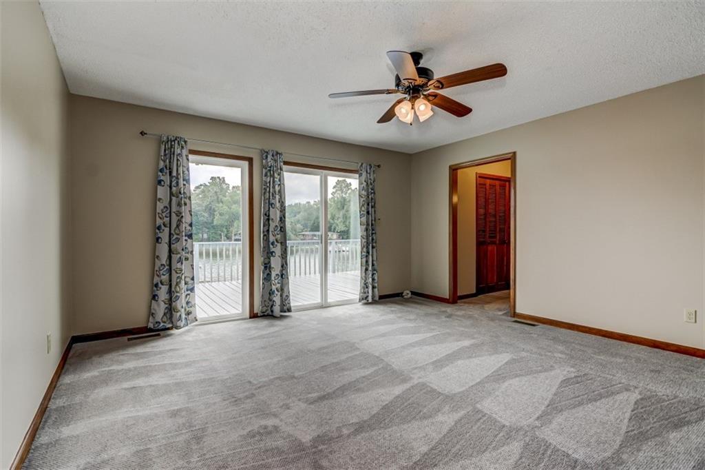 3972 Lake Shore Road South Denver, NC 28037 - Photo 36 of 48 a view of a livingroom with a ceiling fan and window