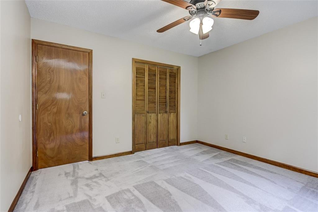 3972 Lake Shore Road South Denver, NC 28037 - Photo 42 of 48 a view of an empty room with window and a chandelier fan