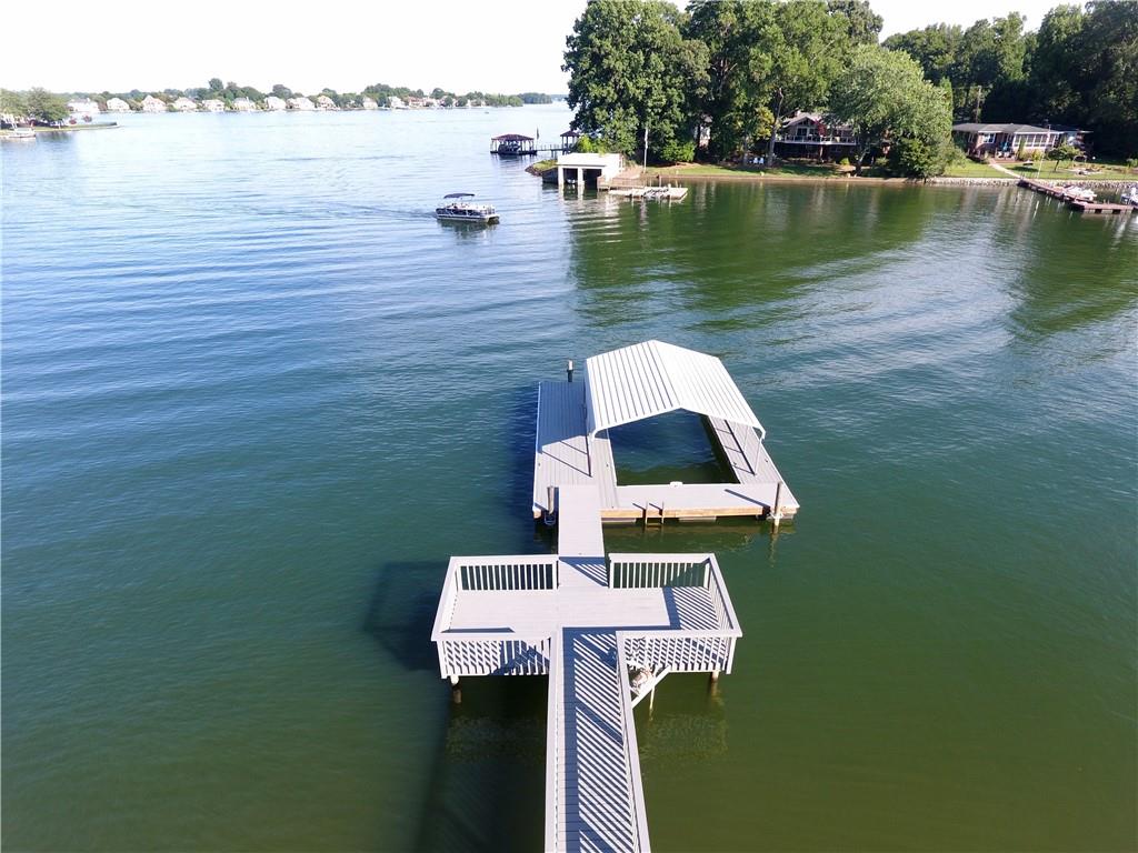 3972 Lake Shore Road South Denver, NC 28037 - Photo 6 of 48 a view of a lake with a table and chairs