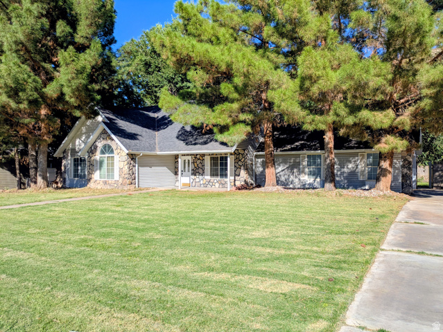 441 Main Street Hurricane, UT 84737 - Photo 6 of 29 Stone and siding exterior with a gabled roofline