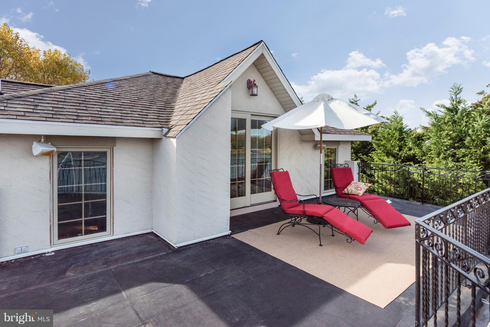 1795 Beachfield Road Annapolis, MD 21409 - Photo 49 of 49 a roof deck with table and chairs and potted plants