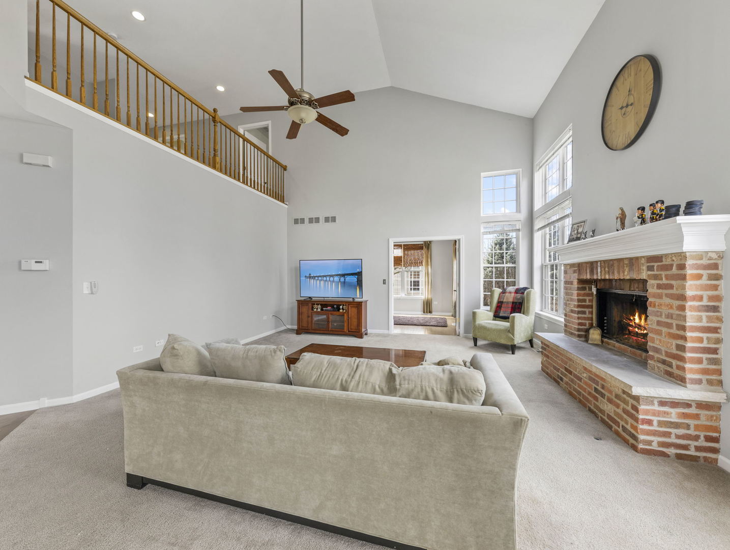 26528 Rustling Birch Way Plainfield, IL 60585 - Photo 11 of 39 a living room with furniture a window and a fireplace