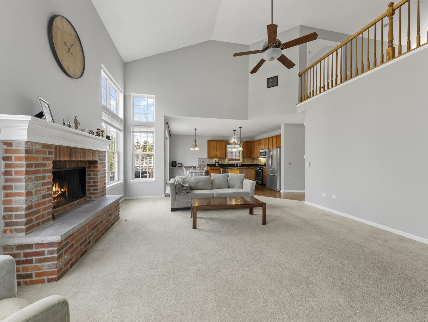 26528 Rustling Birch Way Plainfield, IL 60585 - Photo 12 of 39 a living room with furniture and a fireplace