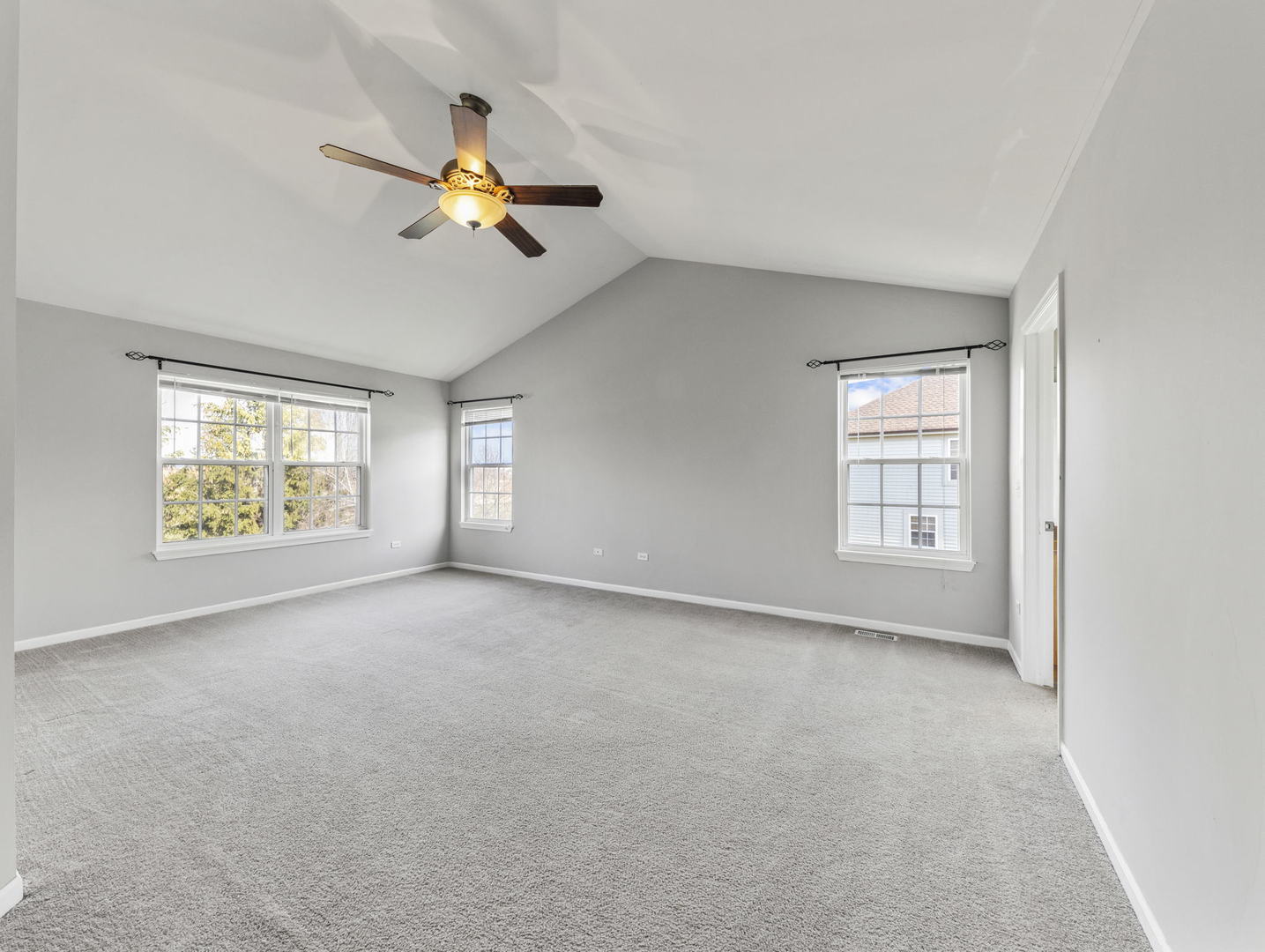 26528 Rustling Birch Way Plainfield, IL 60585 - Photo 18 of 39 an empty room with windows and fan