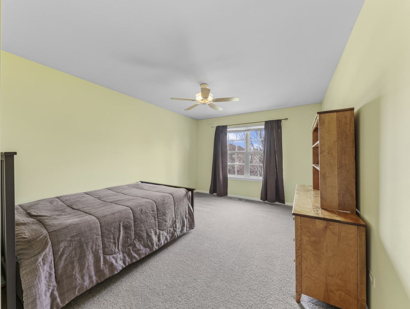26528 Rustling Birch Way Plainfield, IL 60585 - Photo 23 of 39 a bed room with a bed and a refrigerator