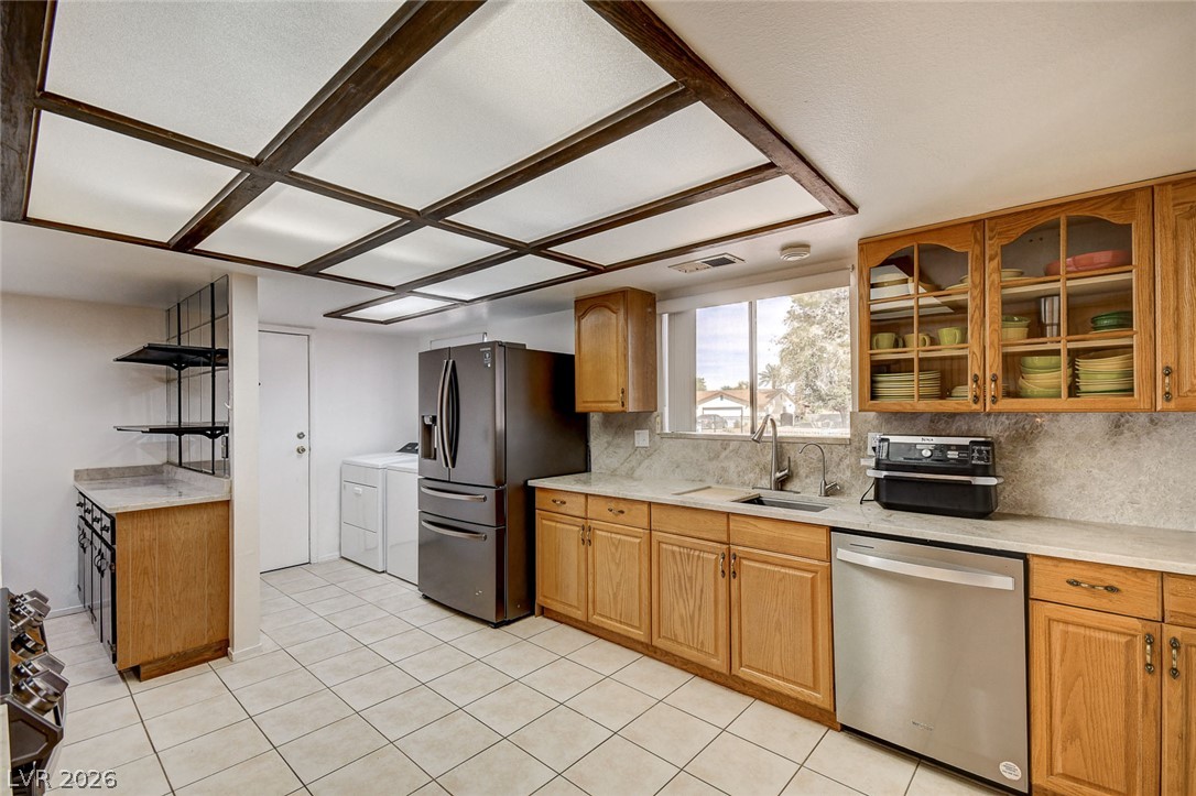 1401 Sharon Road Las Vegas, NV 89106 - Photo 41 of 73 Functional kitchen design integrates natural wood cabinetry with durable tile flooring.