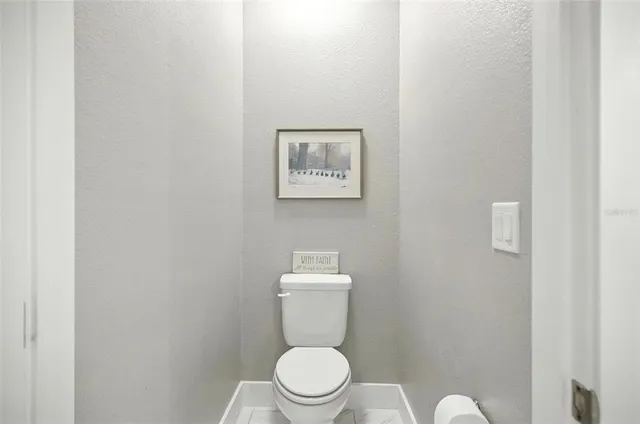 a living room filled with furniture and a large window