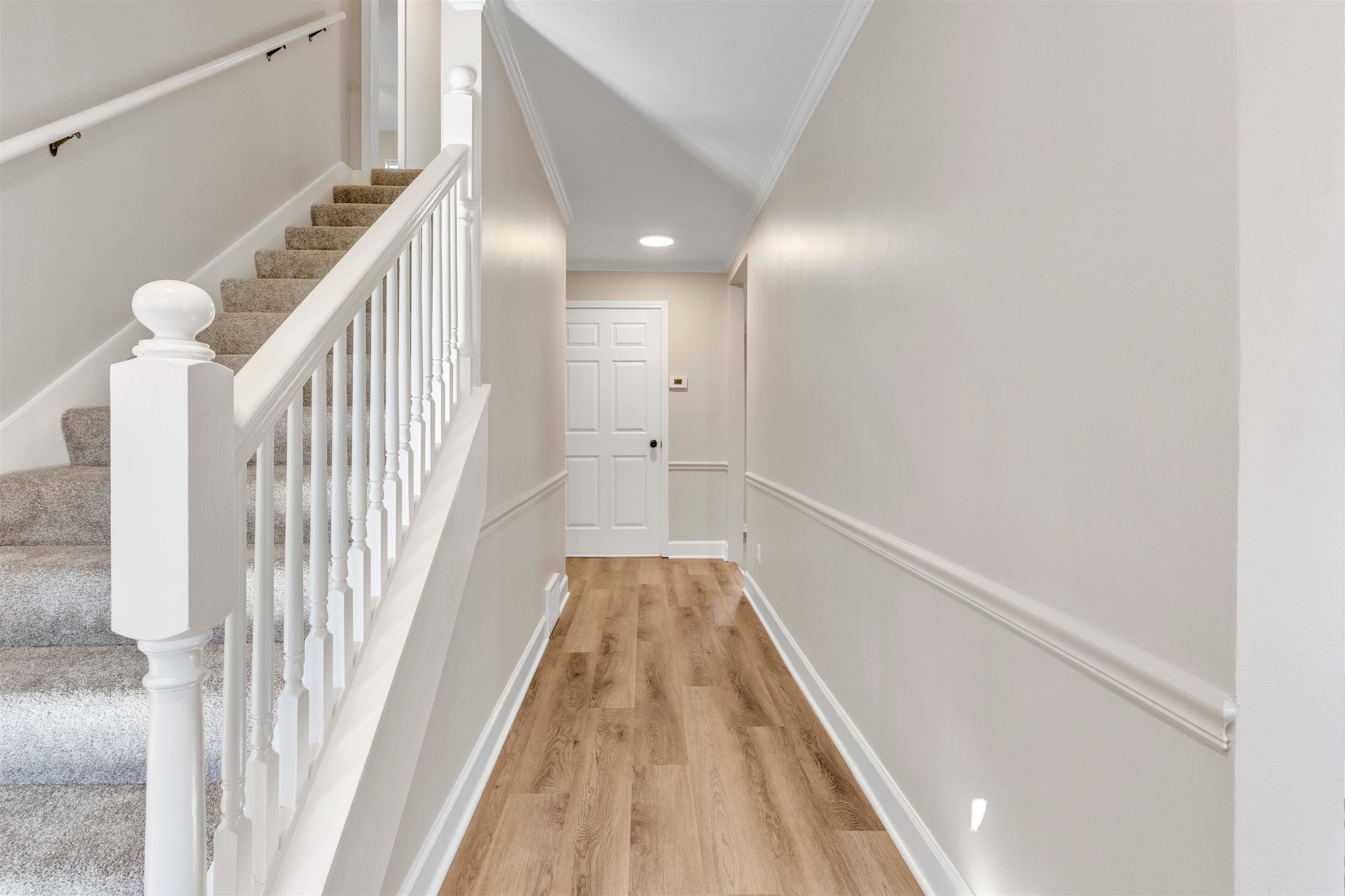 310 Walnut Bend Road Arlington, TN 38002 - Photo 16 of 40 a view of a hallway with wooden floor and staircase