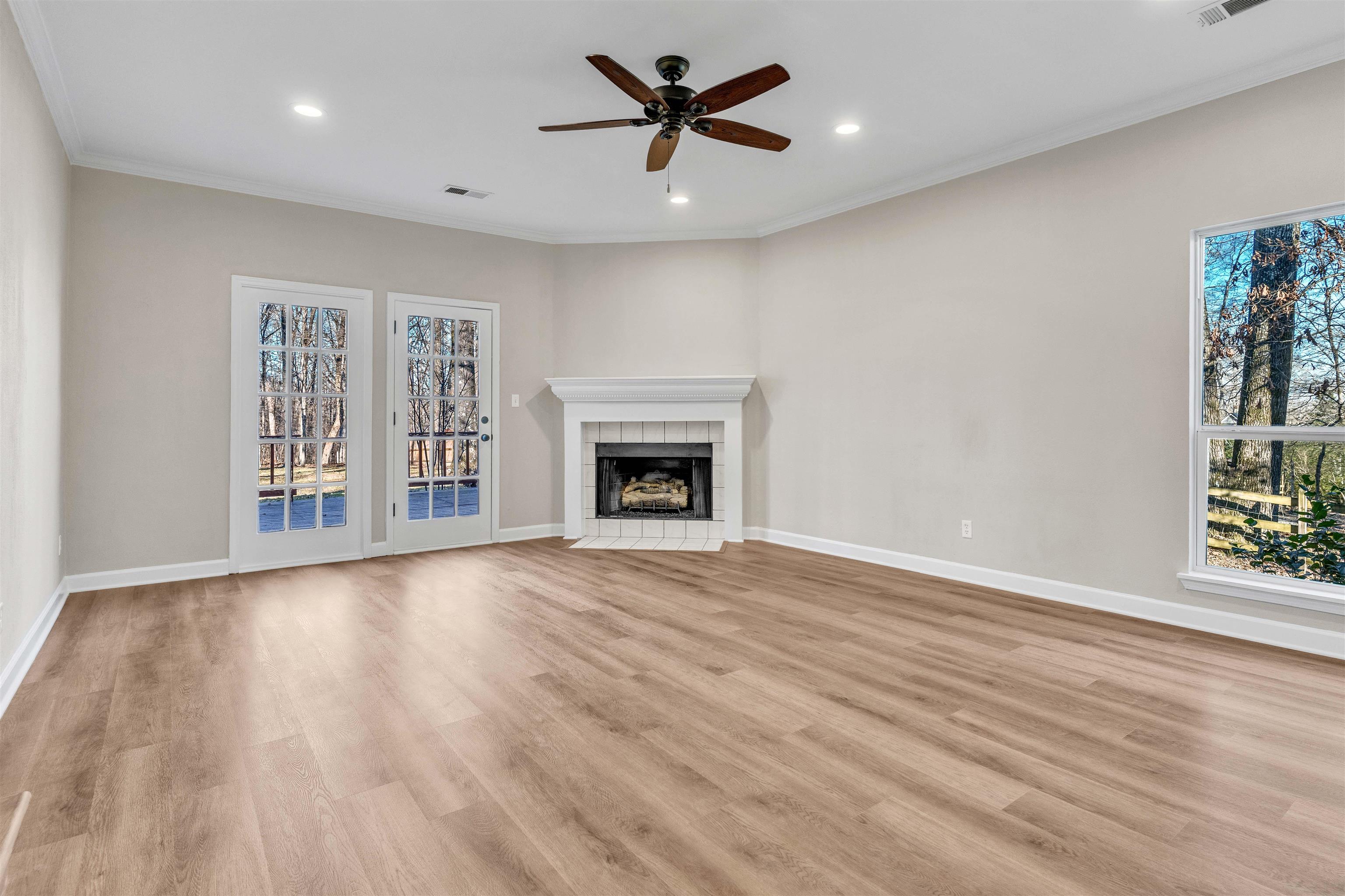 310 Walnut Bend Road Arlington, TN 38002 - Photo 2 of 40 a view of an empty room with a window and a fireplace
