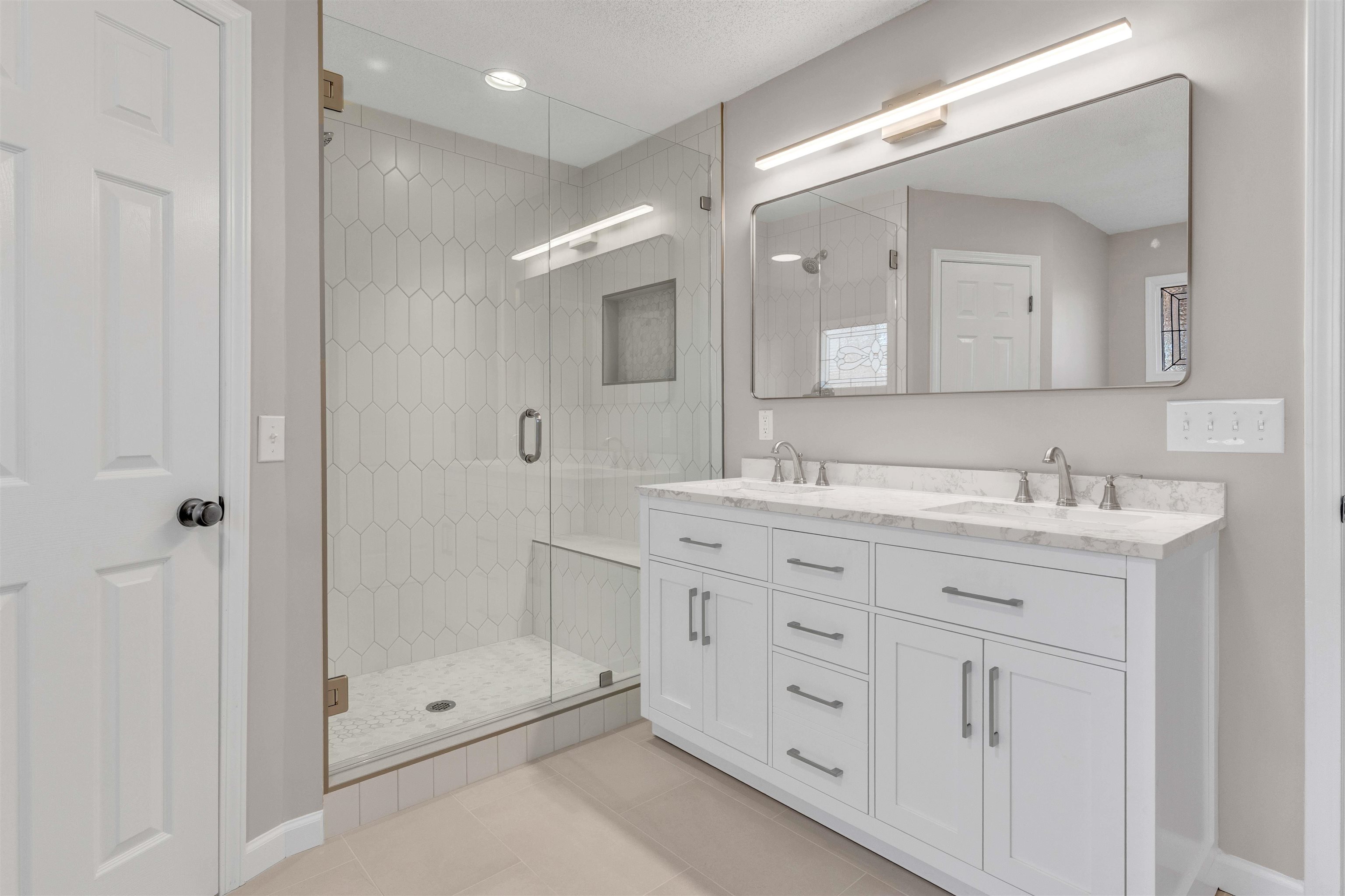 310 Walnut Bend Road Arlington, TN 38002 - Photo 21 of 40 a bathroom with a granite countertop sink mirror and shower