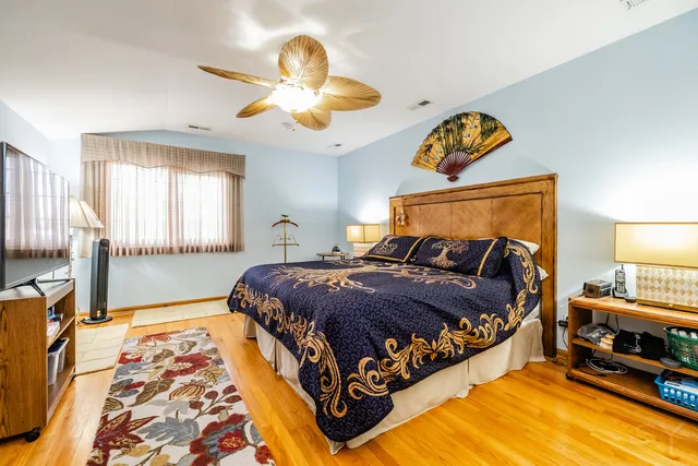 a bedroom with bed and window