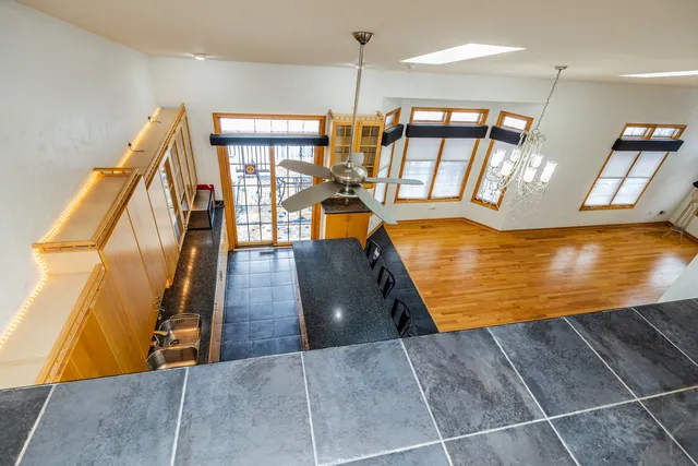 a view of an chairs and table in a room