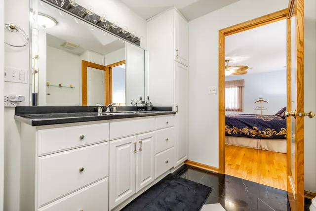 a bathroom with a sink and a mirror