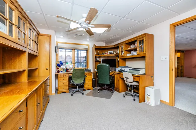 a view of a room with workspace and windows