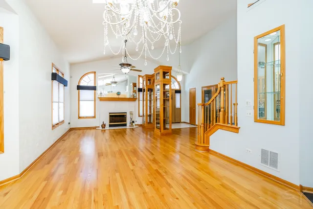 a view of an entryway with wooden floor