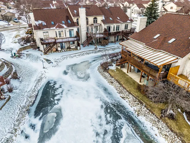 a view of a large building in front of a house