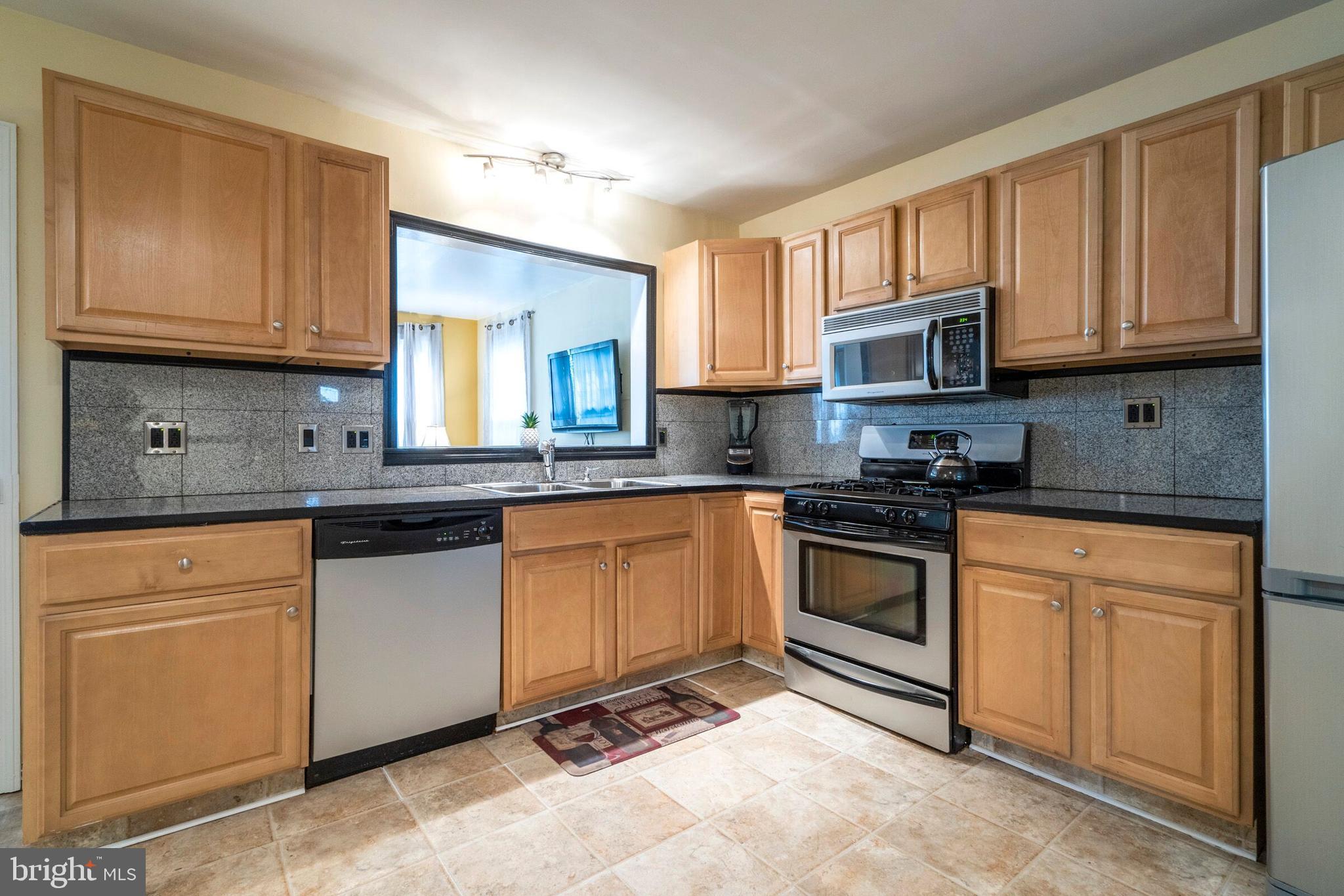 2311 Springview Road East Norriton, PA 19401 - Photo 13 of 51 Kitchen with view on Sunroom