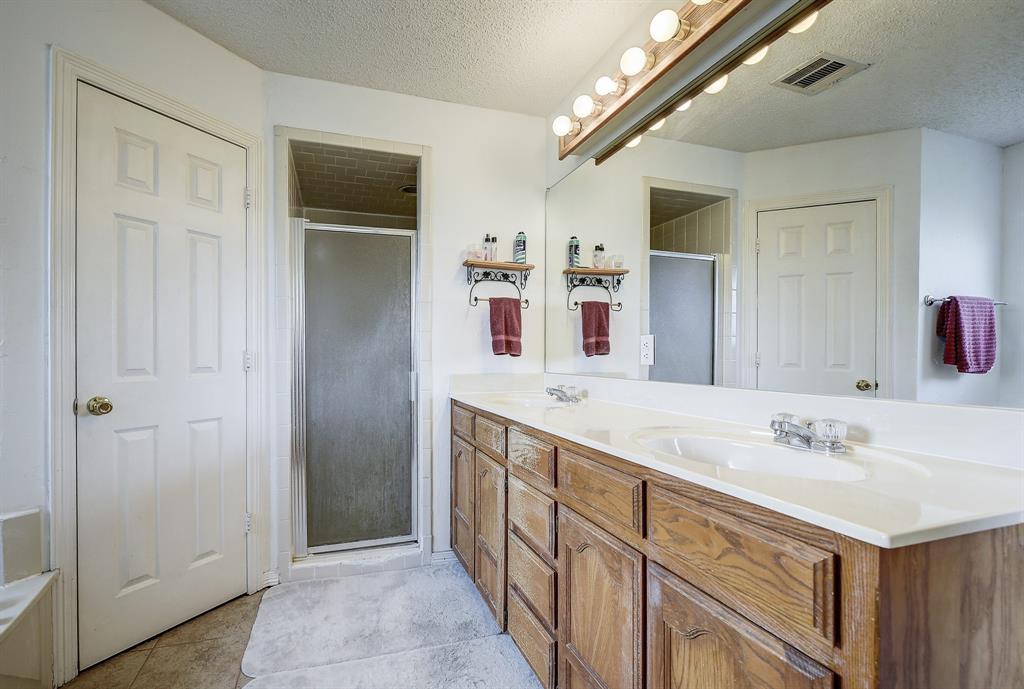 365 Country Lane Haslet, TX 76052 - Photo 19 of 34 a spacious bathroom with a double vanity sink and mirror