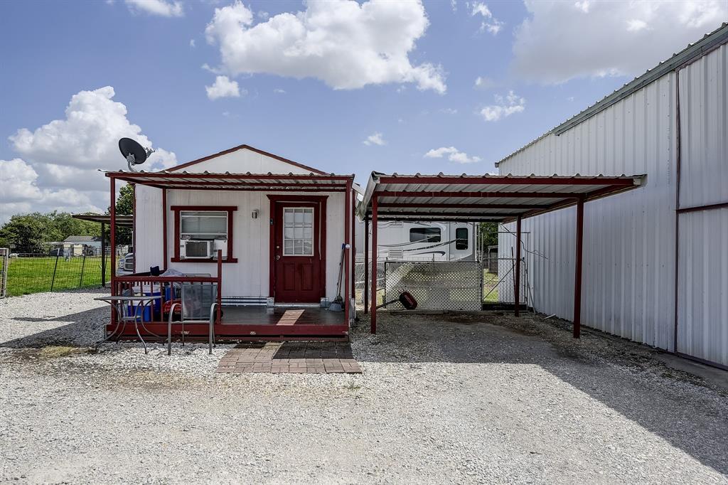 365 Country Lane Haslet, TX 76052 - Photo 24 of 34 a view of house with a large window and table in a patio
