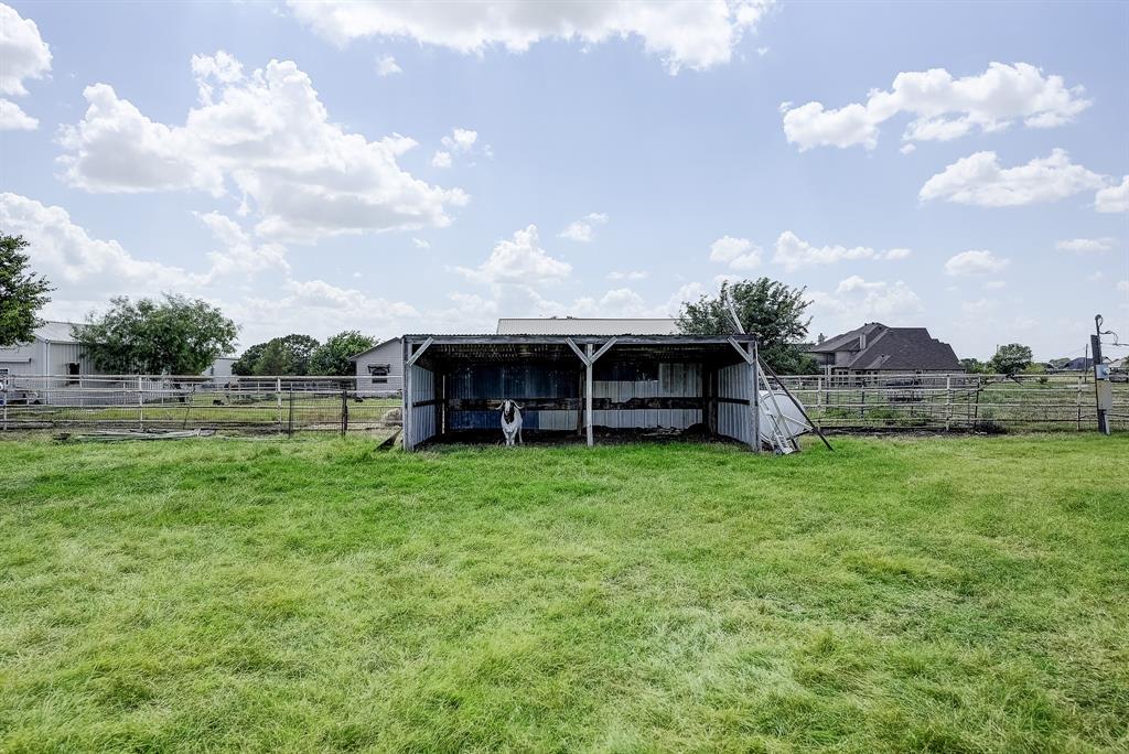 365 Country Lane Haslet, TX 76052 - Photo 29 of 34 a view of a house with a big yard and a large tree